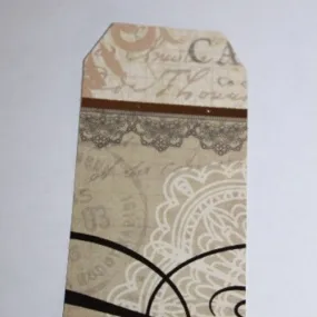 1 etiquette scrapbooking, avec oeillet, vintage, sepia, env 10,3cm x 5.5cm
