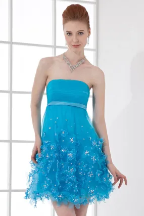 Petite robe turquoise de cocktail bustier ornée de paillettes